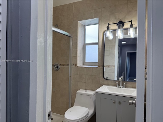 1345 NE 199th St, Miami, FL 33179 - bathroom with a stall shower, vanity, toilet, and tile walls