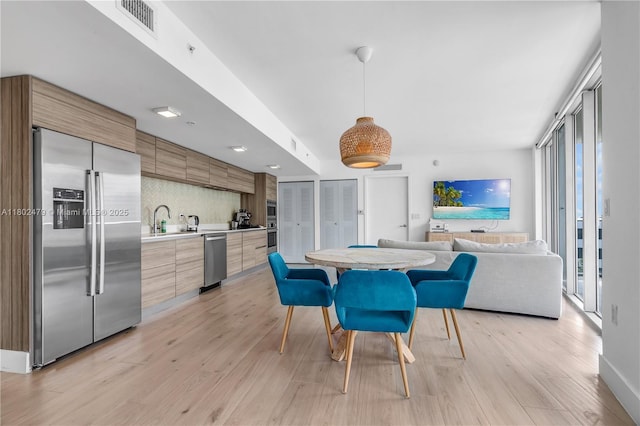 6620 Indian Creek Dr Unit 619, Miami Beach, FL 33141 - dining room featuring light wood-style flooring