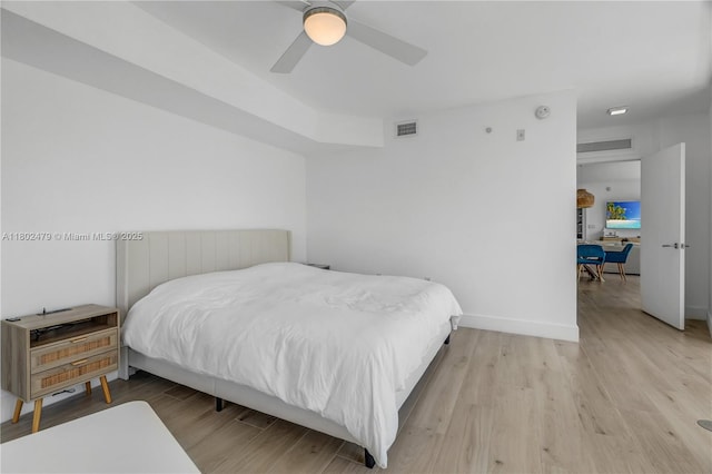 6620 Indian Creek Dr Unit 619, Miami Beach, FL 33141 - bedroom featuring wood finished floors, baseboards, ceiling fan, and a desk