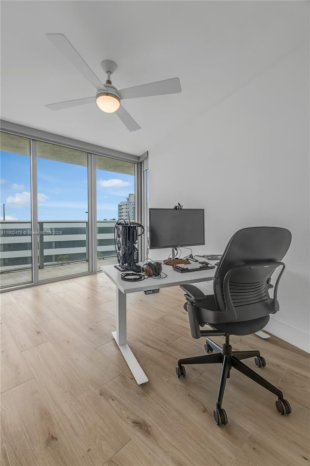6620 Indian Creek Dr Unit 619, Miami Beach, FL 33141 - office featuring floor to ceiling windows, wood finished floors, and ceiling fan