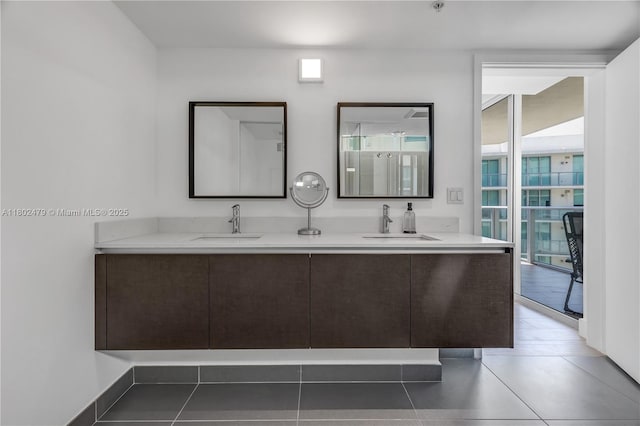 6620 Indian Creek Dr Unit 619, Miami Beach, FL 33141 - full bath with plenty of natural light, double vanity, and tile patterned flooring