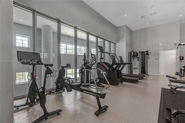 6620 Indian Creek Dr Unit 619, Miami Beach, FL 33141 - gym with plenty of natural light, a towering ceiling, and baseboards