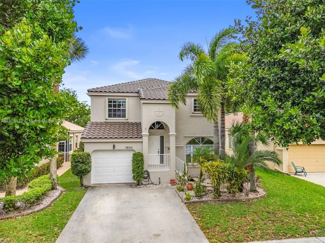 7835 Rockport Cir, Lake Worth, FL 33467 - mediterranean / spanish-style home with stucco siding, a tiled roof, driveway, and a front lawn