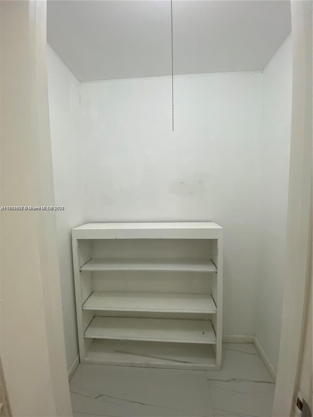 111 Tilford F Unit 111, Deerfield Beach, FL 33442 - spacious closet with marble look tile flooring