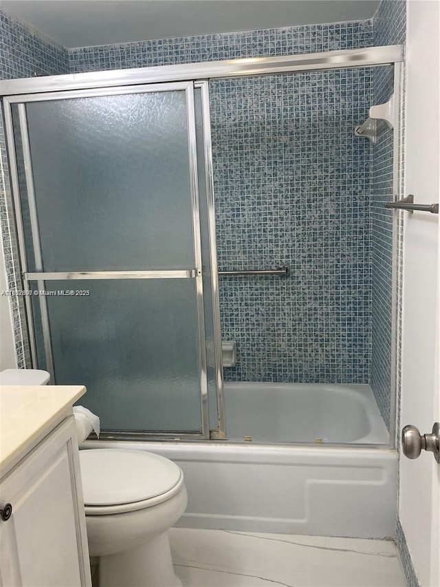 111 Tilford F Unit 111, Deerfield Beach, FL 33442 - bathroom featuring vanity, shower / bath combination with glass door, toilet, and tile patterned flooring