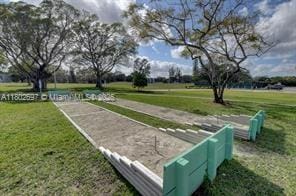 111 Tilford F Unit 111, Deerfield Beach, FL 33442 - view of property's community with a yard and a bocce ball area