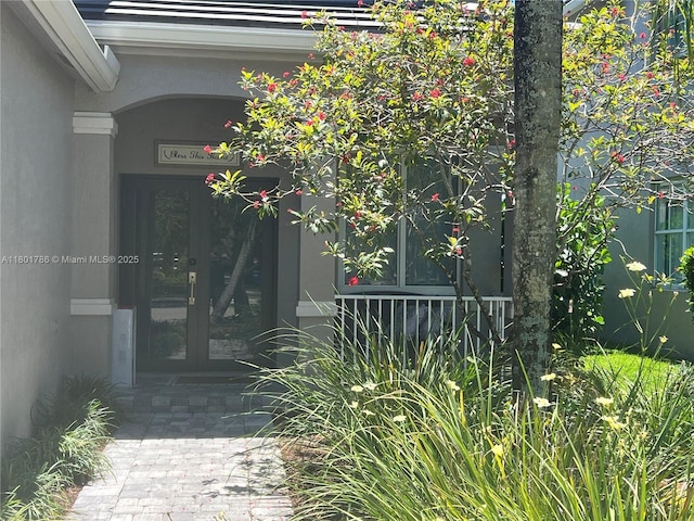 1192 Chinaberry Dr, Weston, FL 33327 - property entrance with french doors and stucco siding