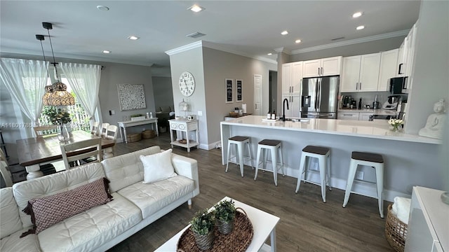 1192 Chinaberry Dr, Weston, FL 33327 - living room with crown molding, dark wood-style floors, baseboards, and recessed lighting