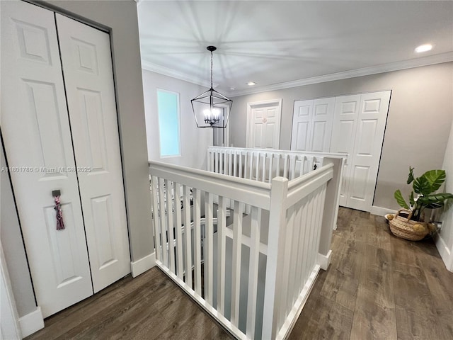 1192 Chinaberry Dr, Weston, FL 33327 - hall featuring an upstairs landing, dark wood-type flooring, a chandelier, crown molding, and baseboards