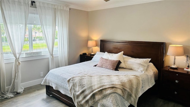 1192 Chinaberry Dr, Weston, FL 33327 - bedroom with wood finished floors, crown molding, and baseboards