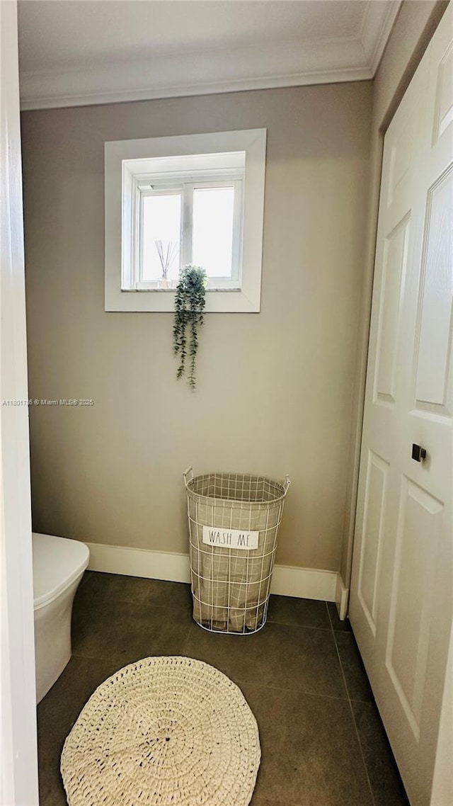 1192 Chinaberry Dr, Weston, FL 33327 - bathroom with ornamental molding, baseboards, toilet, and tile patterned floors