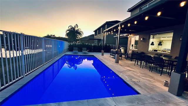 1192 Chinaberry Dr, Weston, FL 33327 - pool at dusk featuring a patio and fence