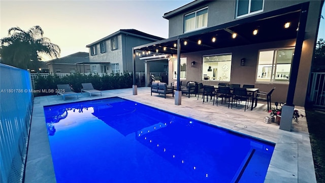 1192 Chinaberry Dr, Weston, FL 33327 - pool at dusk featuring a patio area and fence