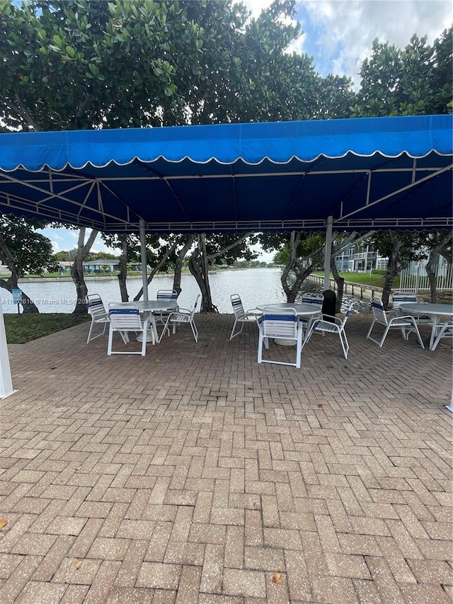9330 Lime Bay Blvd Unit 315, Tamarac, FL 33321 - view of patio featuring a gazebo, a water view, and outdoor dining space