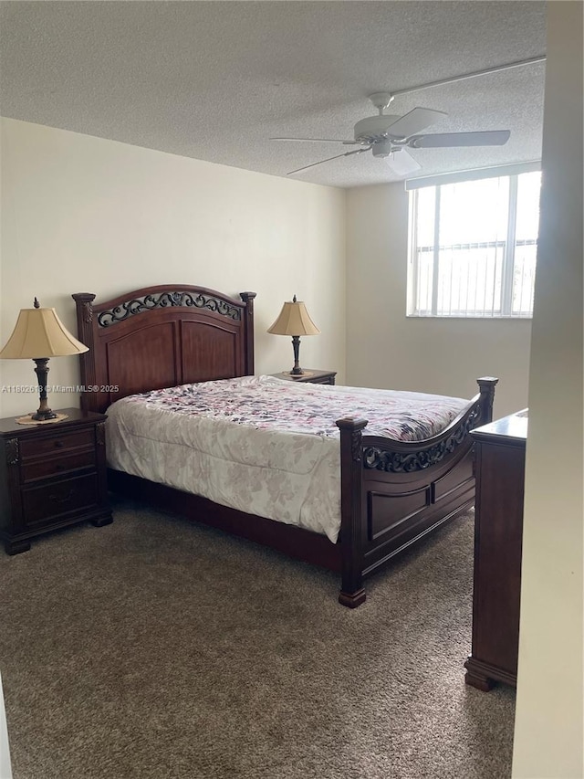 9330 Lime Bay Blvd Unit 315, Tamarac, FL 33321 - bedroom featuring dark colored carpet, a textured ceiling, and a ceiling fan