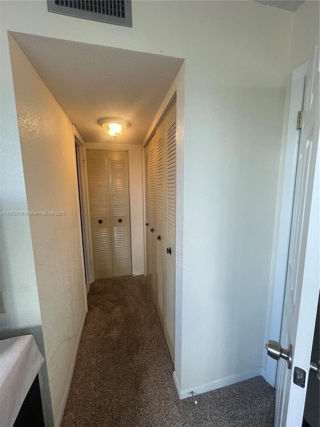9330 Lime Bay Blvd Unit 315, Tamarac, FL 33321 - hall featuring carpet and a textured wall