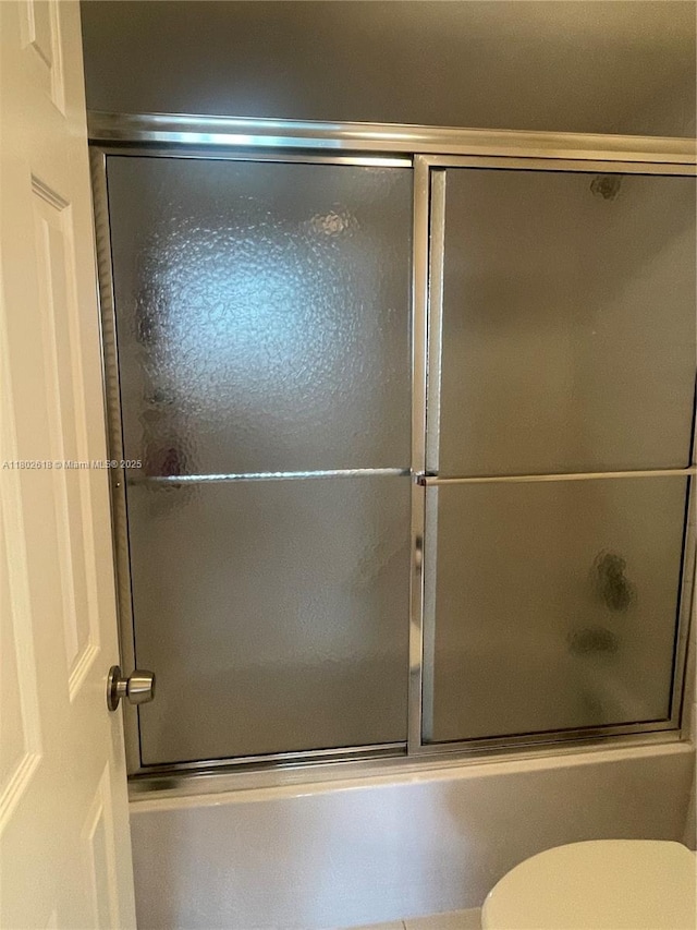 9330 Lime Bay Blvd Unit 315, Tamarac, FL 33321 - bathroom with combined bath / shower with glass door and toilet