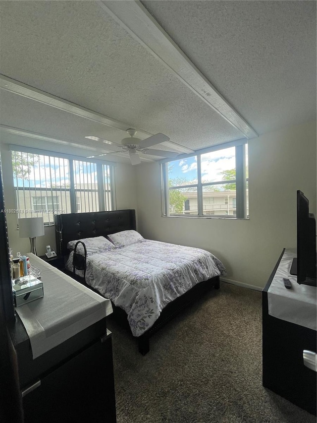 9330 Lime Bay Blvd Unit 315, Tamarac, FL 33321 - bedroom featuring a textured ceiling, carpet flooring, baseboards, and ceiling fan