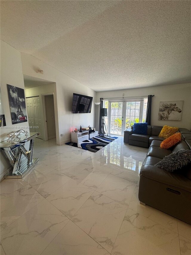 19321 NW 83rd Ave, Hialeah, FL 33015 - living area featuring light marble finish floors, a textured ceiling, and vaulted ceiling