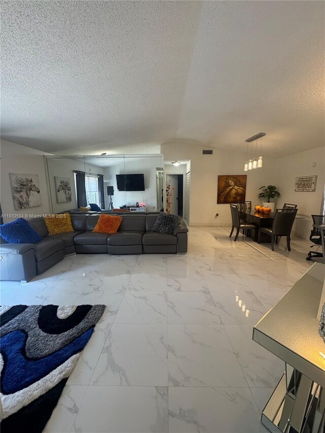 19321 NW 83rd Ave, Hialeah, FL 33015 - living area featuring a textured ceiling and marble finish flooring