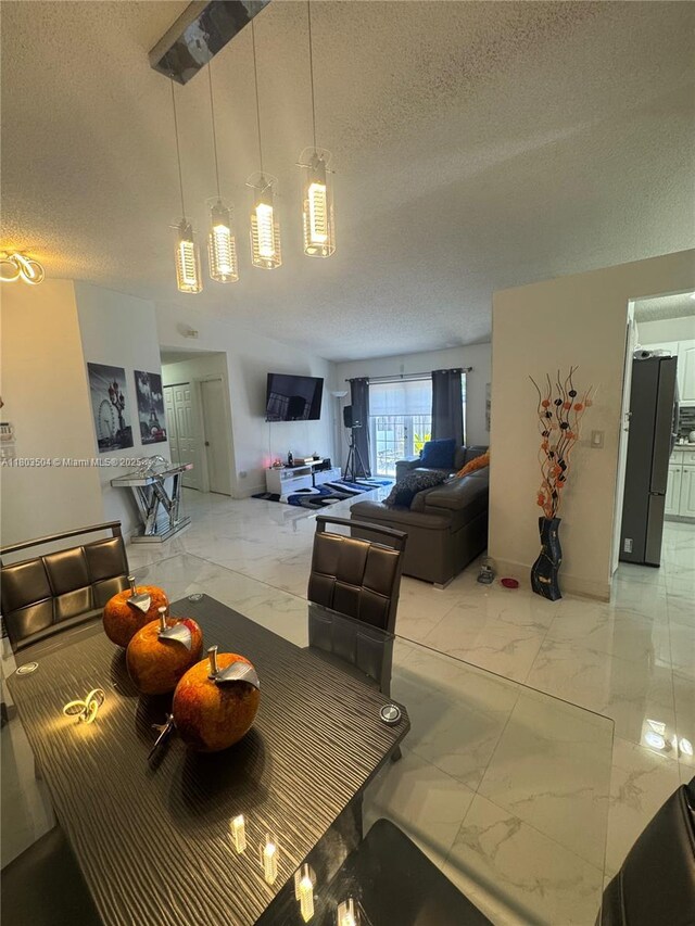 19321 NW 83rd Ave, Hialeah, FL 33015 - dining space with light marble finish flooring and a textured ceiling