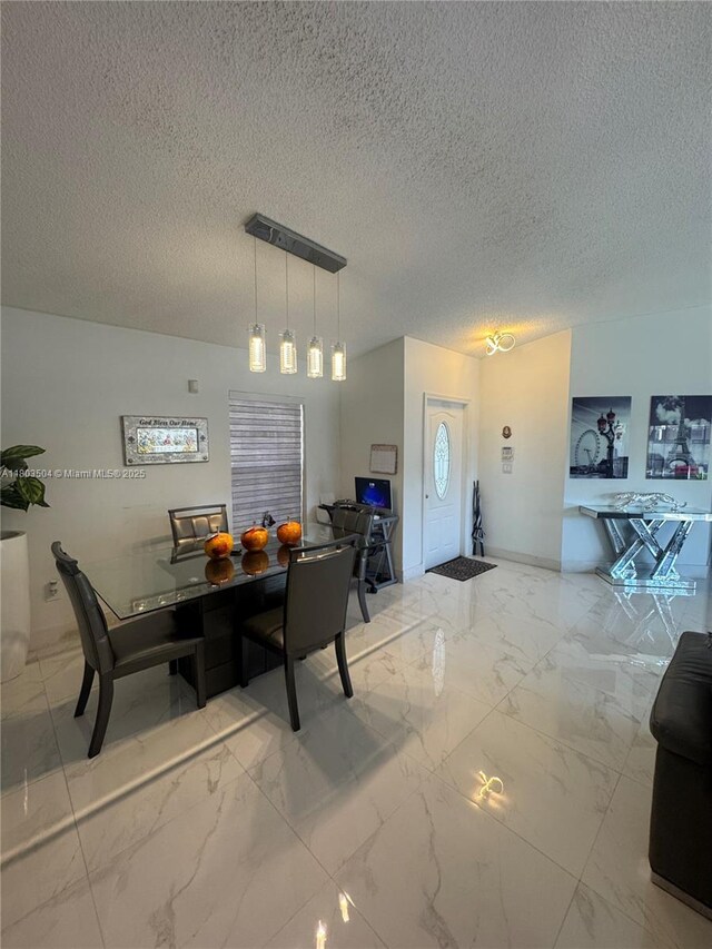 19321 NW 83rd Ave, Hialeah, FL 33015 - dining area featuring marble finish floors, a textured ceiling, and baseboards