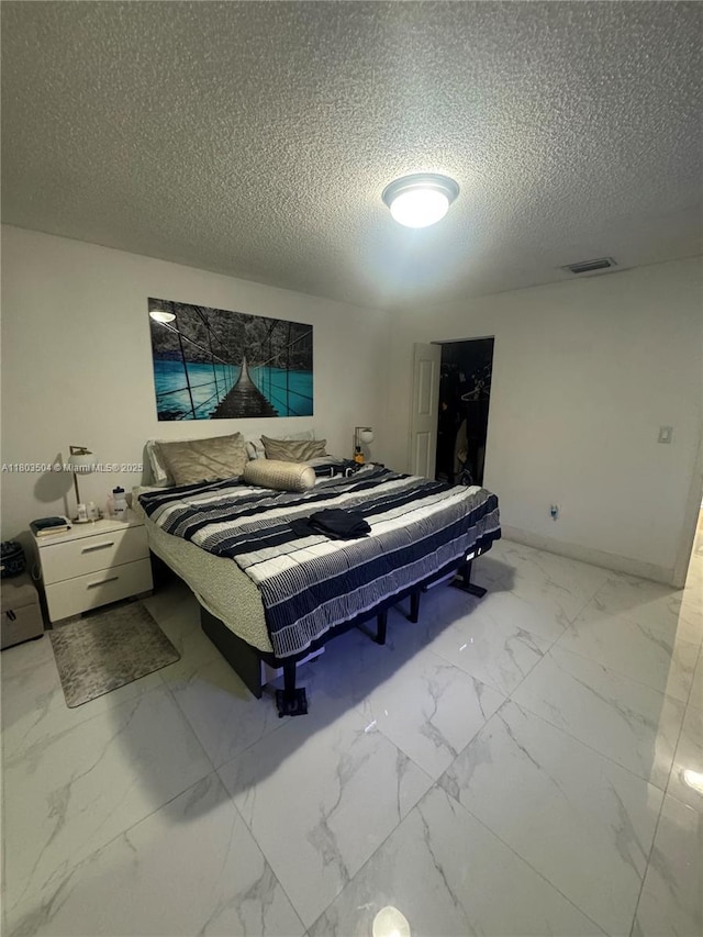 19321 NW 83rd Ave, Hialeah, FL 33015 - bedroom with a textured ceiling and marble finish flooring