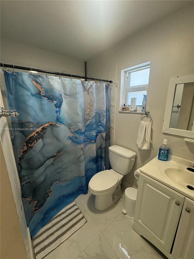 19321 NW 83rd Ave, Hialeah, FL 33015 - full bathroom featuring marble finish flooring, toilet, vanity, and a shower with curtain