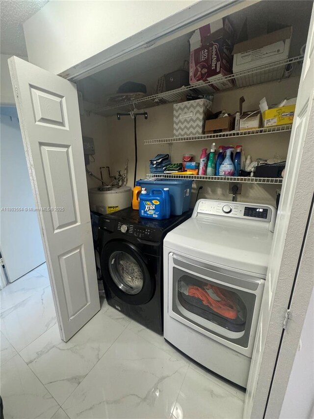 19321 NW 83rd Ave, Hialeah, FL 33015 - laundry room with washer and clothes dryer and marble finish flooring