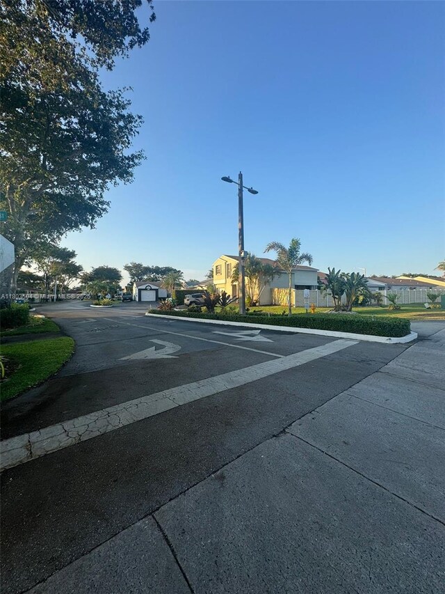 19321 NW 83rd Ave, Hialeah, FL 33015 - view of asphalt street with street lighting and a residential view