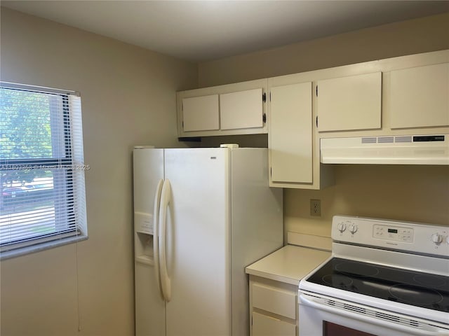 1124 NW 106th Ter Unit 202, Pembroke Pines, FL 33026 - kitchen with white appliances, under cabinet range hood, light countertops, and white cabinets