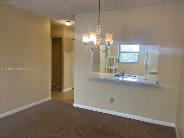 1124 NW 106th Ter Unit 202, Pembroke Pines, FL 33026 - unfurnished dining area with a sink, a chandelier, carpet flooring, baseboards, and a textured ceiling