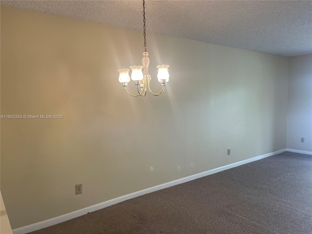 1124 NW 106th Ter Unit 202, Pembroke Pines, FL 33026 - spare room featuring a textured ceiling, a chandelier, dark carpet, and baseboards
