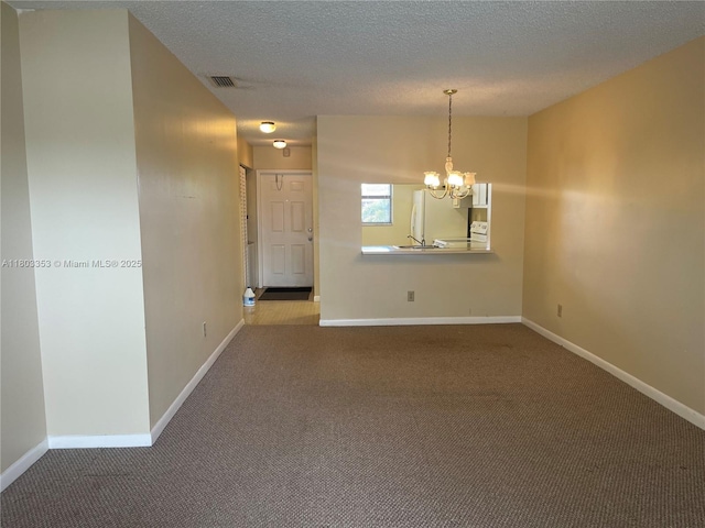 1124 NW 106th Ter Unit 202, Pembroke Pines, FL 33026 - carpeted spare room with a chandelier, baseboards, a textured ceiling, and a sink