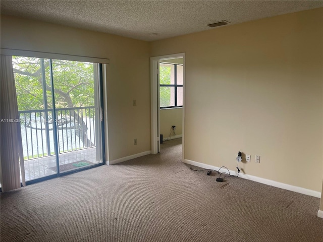 1124 NW 106th Ter Unit 202, Pembroke Pines, FL 33026 - unfurnished room with carpet floors, a textured ceiling, and baseboards