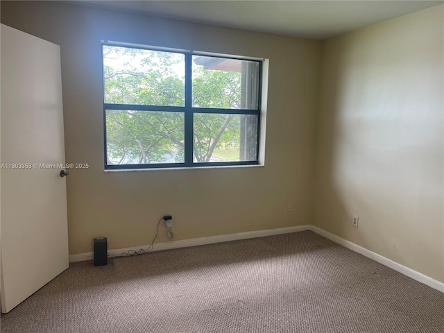 1124 NW 106th Ter Unit 202, Pembroke Pines, FL 33026 - empty room featuring carpet floors and baseboards