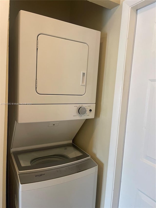 1124 NW 106th Ter Unit 202, Pembroke Pines, FL 33026 - laundry area featuring stacked washing machine and dryer