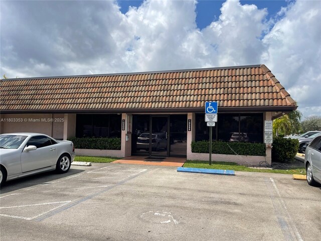 1124 NW 106th Ter Unit 202, Pembroke Pines, FL 33026 - view of property with uncovered parking