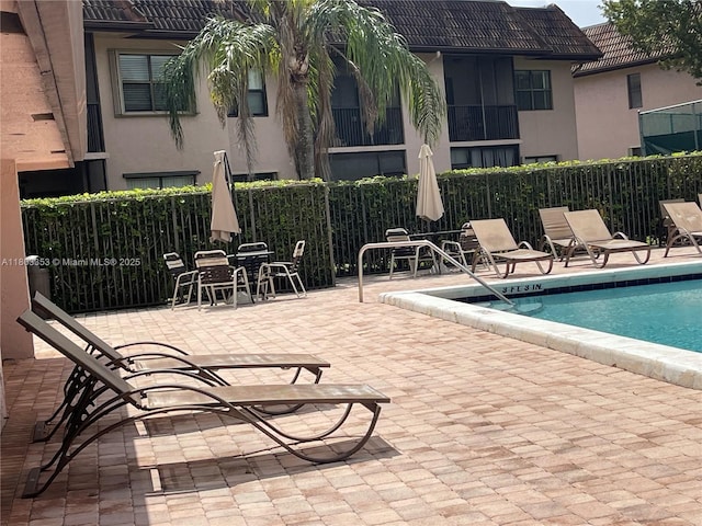 1124 NW 106th Ter Unit 202, Pembroke Pines, FL 33026 - community pool featuring fence and a patio