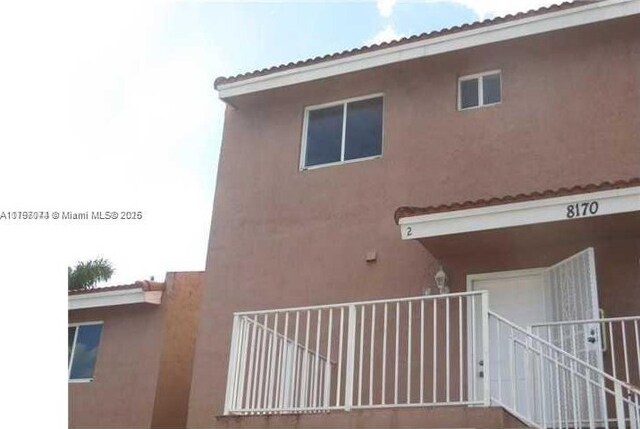 8170 NW 10th St Unit 2, Miami, FL 33126 - view of side of property featuring stucco siding