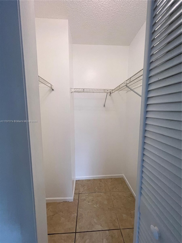 8170 NW 10th St Unit 2, Miami, FL 33126 - walk in closet featuring tile patterned floors