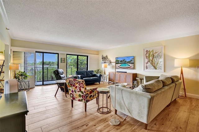 2679 S Ocean Blvd Unit 2B, Boca Raton, FL 33432 - living room featuring a textured ceiling, light wood finished floors, and crown molding