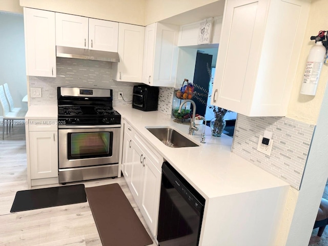 11360 NW 31st St, Sunrise, FL 33323 - kitchen with stainless steel gas range, dishwasher, under cabinet range hood, a sink, and light countertops