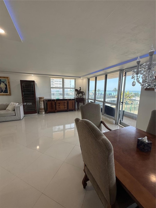 1912 S Ocean Dr Unit 3D, Hallandale Beach, FL 33009 - living area with plenty of natural light, a chandelier, and light tile patterned flooring