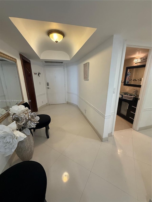 1912 S Ocean Dr Unit 3D, Hallandale Beach, FL 33009 - hallway featuring light tile patterned floors and baseboards