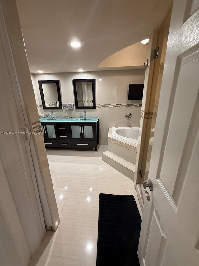 1912 S Ocean Dr Unit 3D, Hallandale Beach, FL 33009 - full bathroom featuring a bath, double vanity, tile patterned floors, recessed lighting, and a shower