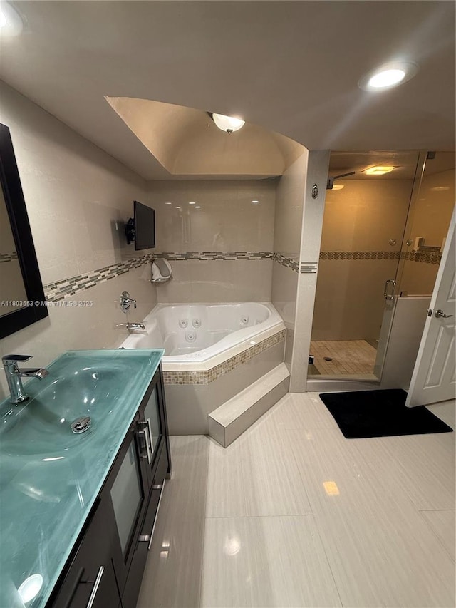 1912 S Ocean Dr Unit 3D, Hallandale Beach, FL 33009 - full bathroom with a tub with jets, a stall shower, vanity, and recessed lighting