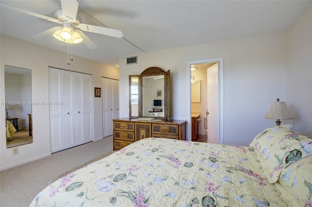 424 SE 10th St Unit 405, Dania Beach, FL 33004 - carpeted bedroom featuring two closets, connected bathroom, ceiling fan, and baseboards