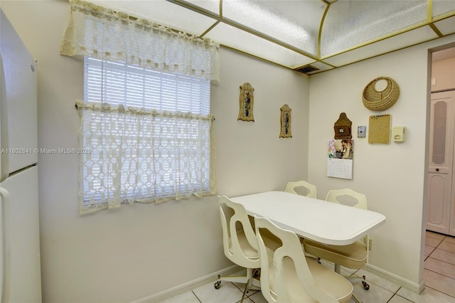 424 SE 10th St Unit 405, Dania Beach, FL 33004 - dining space with light tile patterned floors and baseboards