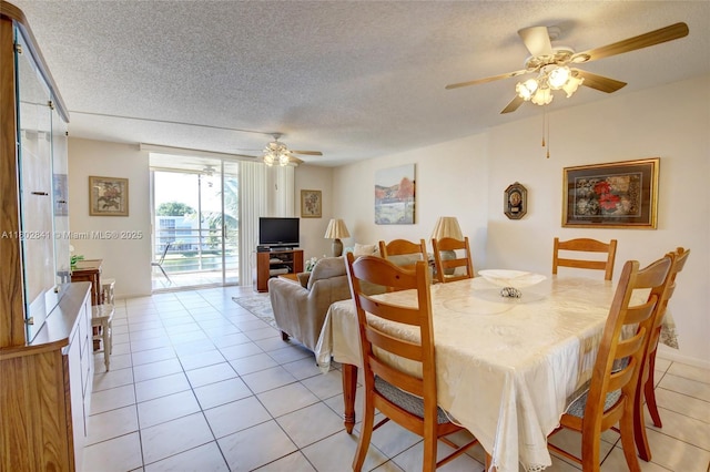 424 SE 10th St Unit 405, Dania Beach, FL 33004 - dining area with ceiling fan, a textured ceiling, and light tile patterned floors